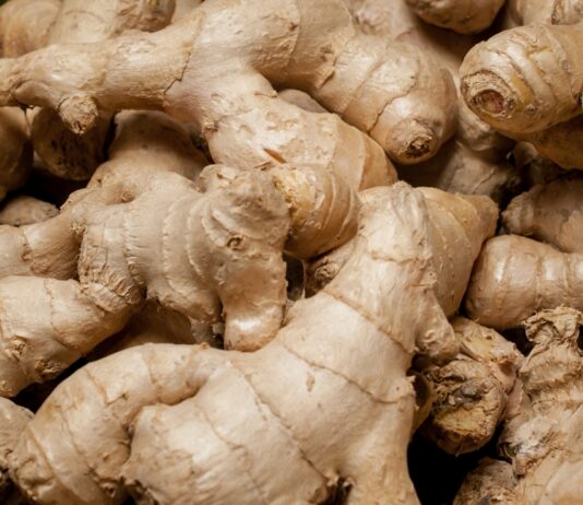 Ginger Health Benefits, Side Effects and Truth About Claims Close up of ginger roots piled on top of each other