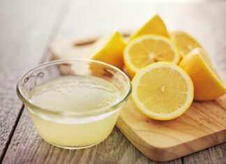 Lemon Water: Why People Love It and What Everyone Should Know Cut lemons and bowl of lemon juice