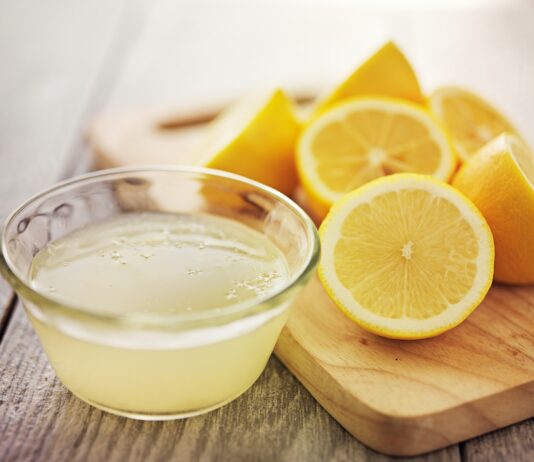 Lemon Water: Why People Love It and What Everyone Should Know Cut lemons and bowl of lemon juice