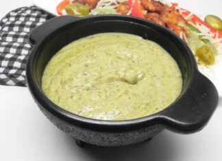 Avocado Cream Sauce Black bowl filled with creamy avocado sauce