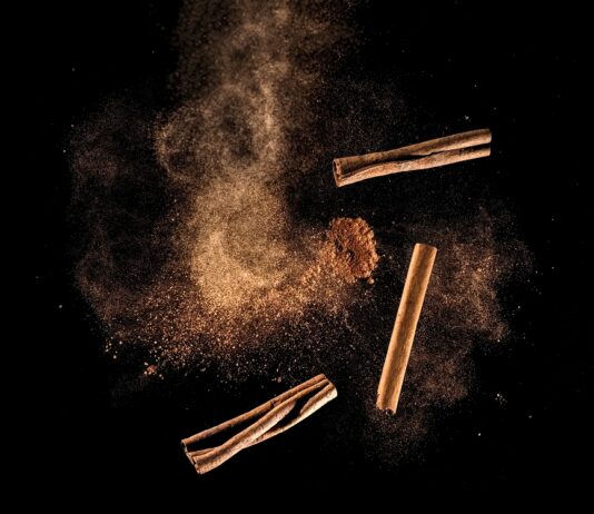 Cinnamon: People Love It but Health Benefits Remain Sketchy Artist's rendition of cinnamon powder and sticks airborne against a black background