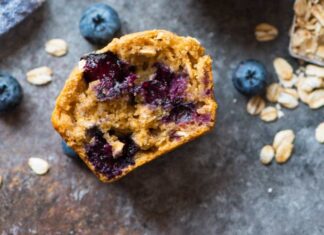 Healthy Blueberry Muffins Cross section of muffin loaded with juicy blueberries
