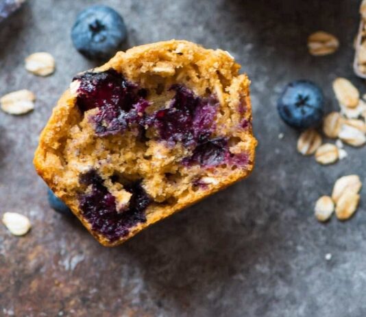 Healthy Blueberry Muffins Cross section of muffin loaded with juicy blueberries