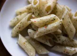 Penne Aglio Olio With Yarrow A plate of penne with spinkles of finely chopped yarrow leaves