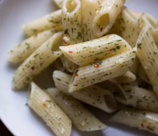Penne Aglio Olio With Yarrow A plate of penne with spinkles of finely chopped yarrow leaves