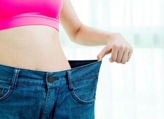 Overweight Thin woman wearing big jeans from when she was fatter