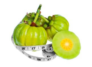 Garcinia Cambogia: Weight Loss Helper or Risky Solution? Bundle of fresh garcinia cambogia fruit with a measuring tape wrapped around it