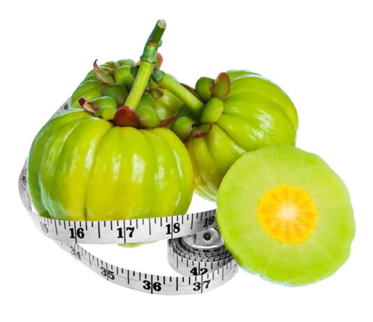 Garcinia Cambogia: Weight Loss Helper or Risky Solution? Bundle of fresh garcinia cambogia fruit with a measuring tape wrapped around it